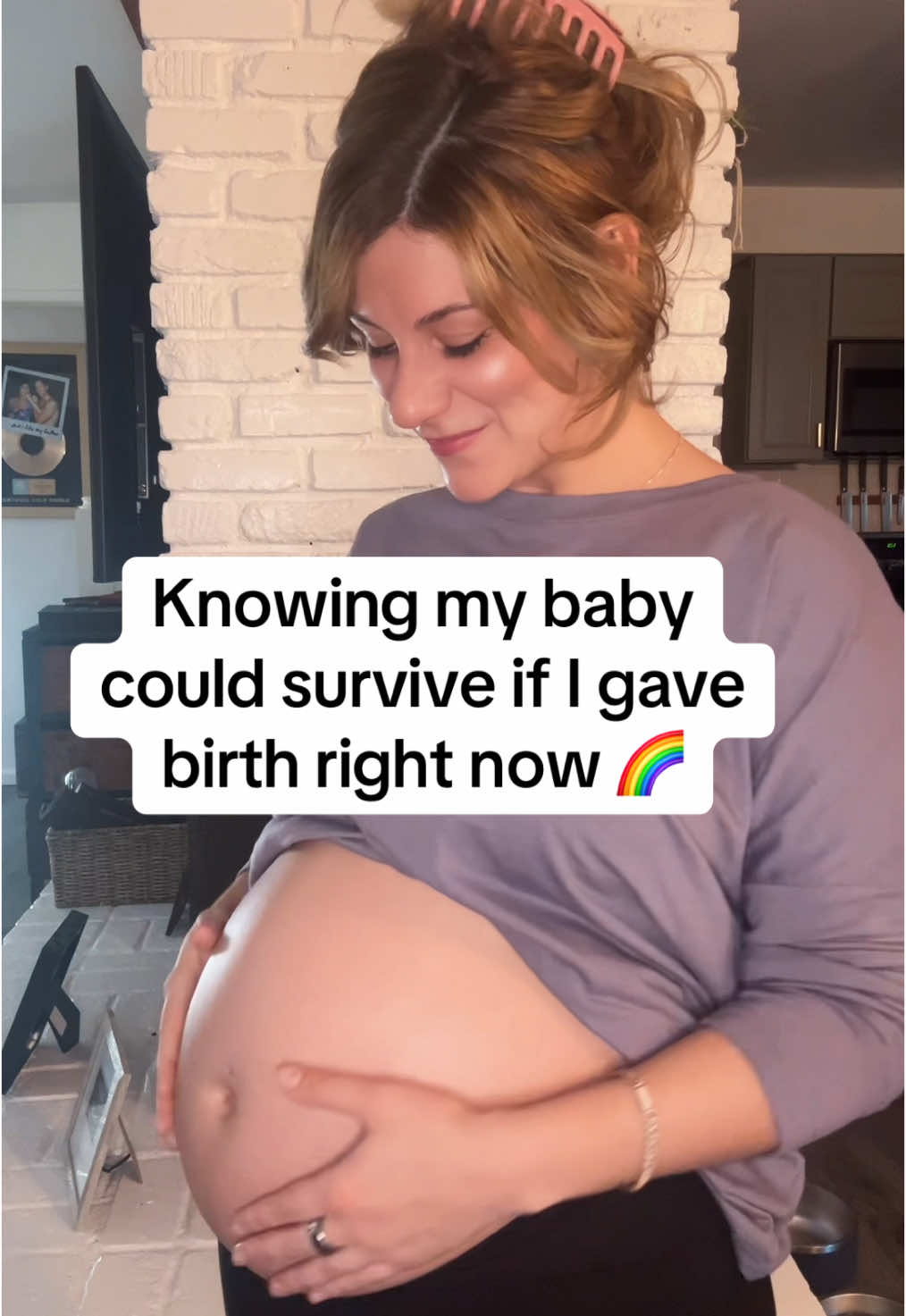 A post by @jaxwritessongs on TikTok caption: Taking my first big sigh of relief in 6 months. Pregnancy after loss can be a really beautiful, and anxiety-ridden experience.  Happy viability week, baby girl. Stay in my belly as long as you need. I will celebrate you for the rest of my life. 🩷🎂💪🏼👶🏼