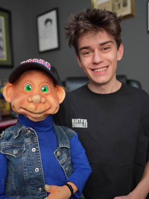 A post by @nikolasbushi on TikTok caption: New hat for Chris! 🧢🧑🏼‍🦰 #nikolasbushi #christhepuppetking #tiktok #fyp #fy #ventriloquist #ventriloquism #viral #funny #comedy 