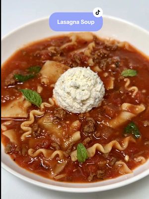 A post by @chefgenevieve on TikTok caption: #ad Lasagna Soup✨This rich, flavorful dish is the ultimate comfort food on a chilly evening ❄️🍲. Warm, satisfying, and filling the house with an irresistible aroma—it’s everything you crave in a cozy meal 🏠✨ I was able to find everything I needed at @Sprouts Farmers Market  Crock Pot Lasagna Soup Recipe Ingredients: 1 small or 1/2 large yellow onion, diced 4 cloves garlic, minced  1lb Sprouts grass fed lean ground beef  2 Tbsp Sprouts tomato paste 1 28oz can Sprouts crushed Roma sauce  1 14.5oz can Sprouts petite diced Roma tomatoes 4 cups Sprouts grass fed beef broth 2 cups water  2 tsp dried Italian seasoning 2 tsp salt 1/2 tsp red pepper flakes  1/2 lb Sprouts organic lasagna noodles, broken in bite sized pieces  Handful of freshly torn basil + more for garnish  For the cheese mixture: 1 cup Sprouts shredded mozzarella cheese 1 cup ricotta cheese 1/2 cup grated parmesan cheese 1 tsp dried parsley flakes Salt and pepper to taste Heat a large non-stick skillet over medium heat. Sautee onions until translucent then add the garlic, cook one more minute. Add the beef and cook on high heat until browned. Add tomato paste and cook until deepened in color. Transfer to a crock pot. Add ground beef mixture, crushed Roma tomatoes, petite diced tomatoes, beef broth, water, Italian seasoning, red pepper flakes and salt. Cook on low for 6-8 hours or high for 2-3 hours. Thirty minutes before serving, add the broken lasagna pieces and turn on high. (The lasagna noodles will take 30 minutes to cook). Stir in fresh basil just before serving.  For the cheese mixture, combine shredded mozzarella cheese, ricotta cheese, Parmesan cheese, parsley flakes and salt and pepper. Serve lasagna soup in a bowl with a scoop of the cheese mixture and garnish with more fresh basil leaves.  Enjoy! Substitutions found at Sprouts: Gluten free - swap lasagna noodles with gluten free pastas such as fusilli, penne, elbows or rotini Dairy free - swap for dairy free versions of shredded mozzarella and Parmesan cheese Vegetarian- swap with plant based ground beef Vegan - swap with plant-based ground beef and dairy free versions of shredded mozzarella and Parmesan cheese #LasagnaSoup #CrockpotRecipes #SlowCookerRecipes #LoveSprouts #DinnerRecipes