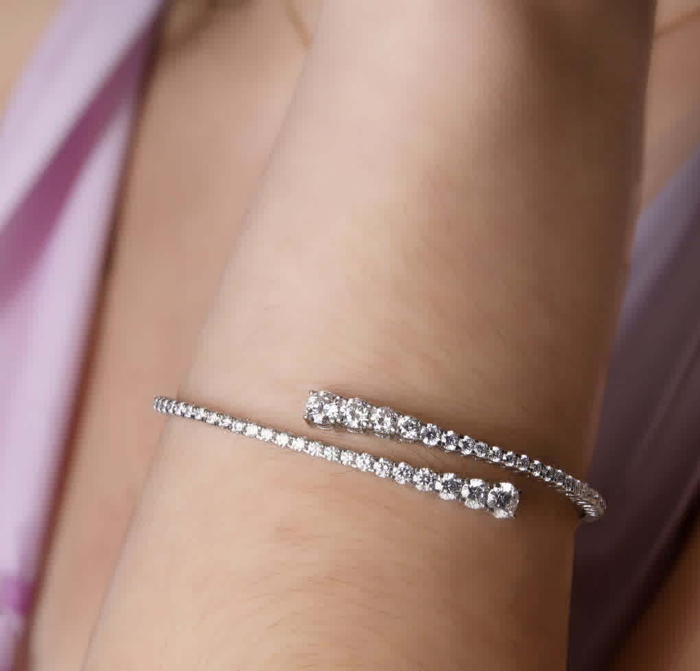 A post by @superjeweler on TikTok caption: wrap your wrist in luxurious diamonds💎✨ #superjeweler #diamondbracelet #nycjeweler #diamondbangle