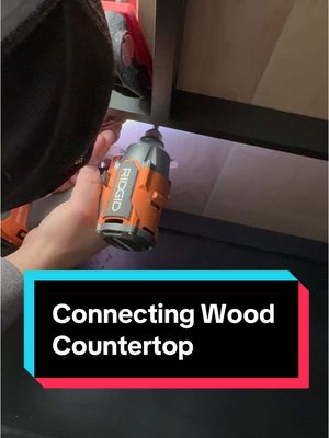 A post by @stayathomewoodworks on TikTok caption: Connecting a butcher block countertop  in a tight space. #woodworking #countertop #butcherblock #howto #DIY #woodwork  