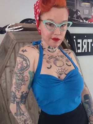 A post by @misspumpkin13 on TikTok caption: New top 💙  #pourtoi #rockabillystyle #foryoupage❤️❤️ #rockabillygirl #inked #orangehair #pinup #pinup #pinupgirl 