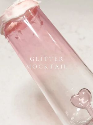 A post by @sophsoph207 on TikTok caption: glitter bomb mocktail 🎀🍾 #valentine #ValentinesDay #mocktail #glitterbomb #diydrink #fundrinks #asmrsounds #pink #asmr #satisfying #sounds #glitterdrinks #fypシ 