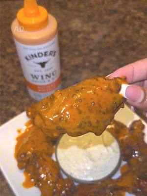 A post by @cookingwithdestiny_ on TikTok caption: Game day just got better with these mouthwatering Buffalo Chicken Wings! 🏈🔥 Made with @Kinder's Flavors Buttery Buffalo Wing Sauce & Ranch Dip Who’s ready to dig in? You can grab Kinder’s Seasonings and Sauces at your local Walmart! #KindersPartner #TasteOfKinders