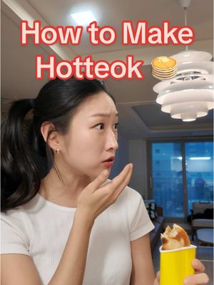 A post by @gracesooda on TikTok caption: Check Hotteok Recipe Here!! ⬇️ . Everything You Need: * Milk - 3/4 cup * Sugar - 1 tbsp * Active dry yeast - 1 tsp * All-purpose flour - 2 cups * Salt - 1 tsp * Any oil - 1 tbsp * Walnuts - 1/3 cup * Sesame seeds - 1.5 tbsp * Brown sugar - 1/4 cup * Cinnamon powder - 1 tsp How to Make: 1. Pour room temperature or slightly warm milk into a bowl. Add sugar and yeast, mix well, and set aside to activate. 2. In another bowl, add flour, salt, and oil. Pour the milk from step 1 into the flour bowl. Mix well with a spoon. 3. When the dough becomes somewhat ball-shaped, knead the dough in the bowl and cover it up! 4. Leave it alone for 1.5 hours, so that it can double in size.  5. Chop up walnuts into small crumbs.  6. In another bowl, mix the chopped-up walnuts, sesame seeds, brown sugar, cinnamon, and a little bit of salt.  7. Now oil up your table/baking tray and divide the dough into 6 balls.   8. In the dough-ball, add a 3 spoonfuls of filling to the center, pinch up the edges to close the ball. Then very gently roll it upside down for a perfect seal.  9. Heat a pan over small heat then oil it. Add the dough balls to the heated pan, and gently press them down until flat like a hotteok. Cook each side until they are golden brown! Done!! . . #korea #korean #koreanculture #edutainer #koreanclass #koreanlanguage🇰🇷 #koreanfood #hotteok #Recipe #koreanrecipe 