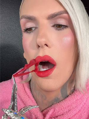 A post by @jeffreestar on TikTok caption: The perfect red lip 💄 LIP COMBO: @SACHEU Beauty US “LeftOnRed” peel-off liner and @Jeffree Star Cosmetics “Redrum” liquid lip balm #makeup #jeffreestar #redlipstick #lipbalm #jeffreestarcosmetics #BeautyTok #lipliner #makeuptutorial #TikTokShop #fyp 