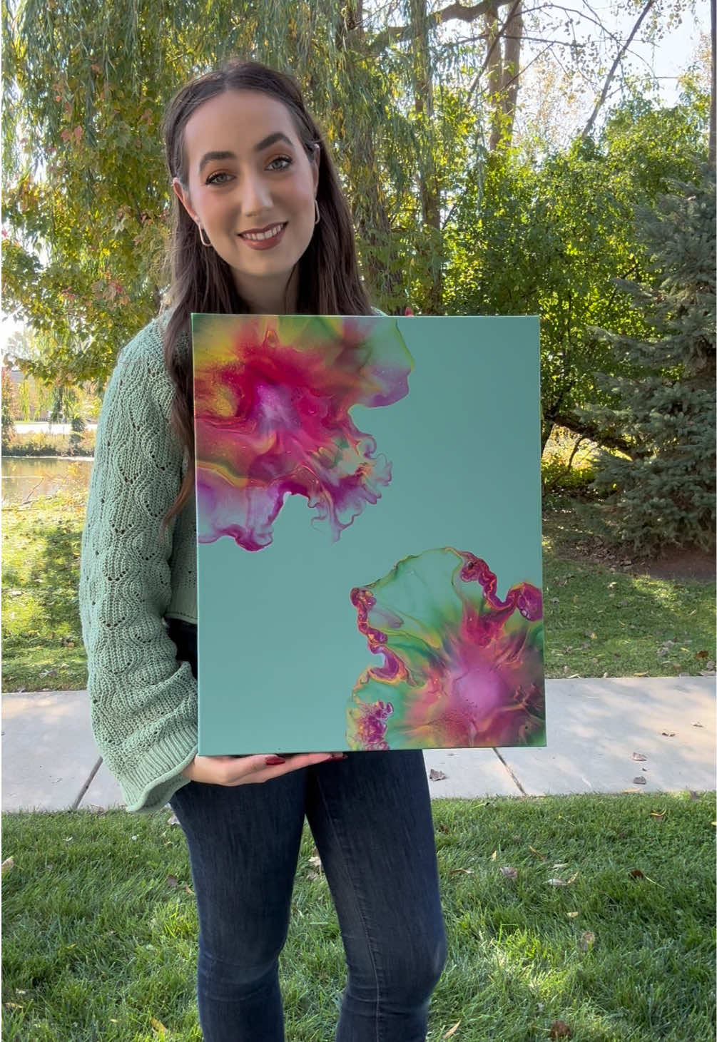 A post by @jessiemilleracrylics on TikTok caption: I love these little flowers 🌺 #fyp #artist #fluidart #dutchpour #flowers #paintingreveal 