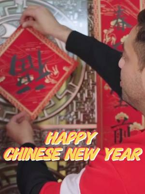 A post by @longhua_shenzhen on TikTok caption: Pasting Spring Festival couplets, watching performances, making dumplings... Simon from South Africa and his family spent a wonderful and lively Year of the Snake Spring Festival in Longhua, Shenzhen, fully enjoying the charm of traditional New Year customs. #Shenzhen #Longhua #SpringFestival #chinatravel #Fyp