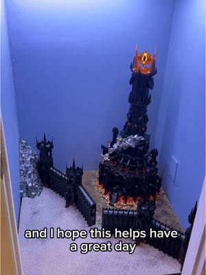 A post by @chrispy_bricks on TikTok caption: I am so glad you all think that the black gate at an angle is the better option! Now we added the ground 😁 #lego #lordoftherings #legolordoftherings @LEGO 