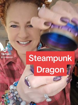 A post by @3sunzzz on TikTok caption: Not a repost, TT glitched 🙃 Hoping for an update 🤞 #letsopen #dragonegg #dragonfidget #anxiety #stem #adhd #steampunkdragon #3dprinted #unboxing #collectibles #tiktokshopcreatorpicks @🙏🏻🎀It's me, Melissa P🎀🙏🏻 