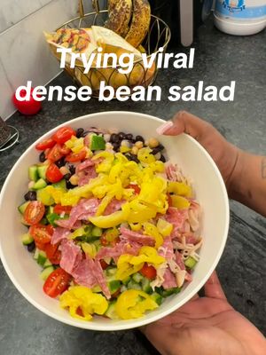 A post by @therealtati on TikTok caption: Trying the viral Dense bean salad 