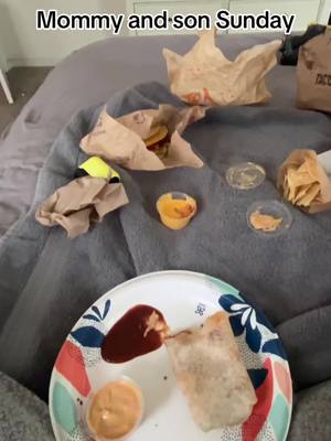 A post by @brittheather06 on TikTok caption: Taco Bell in bed kind of day 💙🌮 #tacobell #sundayfunday #boymom #MomsofTikTok #food #foodislife 