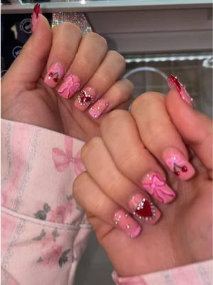 A post by @breedutkiewicz on TikTok caption: Okay I’m a lil obsessed 🎀🍒❤️ #naildesigns #ValentinesDay #valentinesnails 