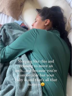 A post by @projectparenthood_ on TikTok caption: Throwback to one of my most hated videos on the internet 😩🤣 the Cosleeping police came for me hard!  I’ll wake up with a stiff neck and a dead arm but ain’t no way I’m moving!  How can I jeopardize my baby’s comfort? 😩🤣 Raise your hand, if you’ve “been there…done that.” 🤣🖐🏻🖐🏼🖐🏽🖐🏾🖐🏿 . . . #m#momcontentp#parentcontentd#dadcontentr#relatablemomm#momcreatorp#postpartumn#newbornn#newmomc#cosleepcosleeping