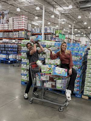 A post by @heatherraeelmoussa on TikTok caption: It’s always a competition with us. Even at @Costco Wholesale shopping for our @DrinkOrgain but it keeps a relationship fresh😉 It’s half strategy, half chaos, 100% chance you’re leaving with more than you planned. But, at least we agree on the protein!🥤✨ #drinkorgain #ad #protein #costcofinds