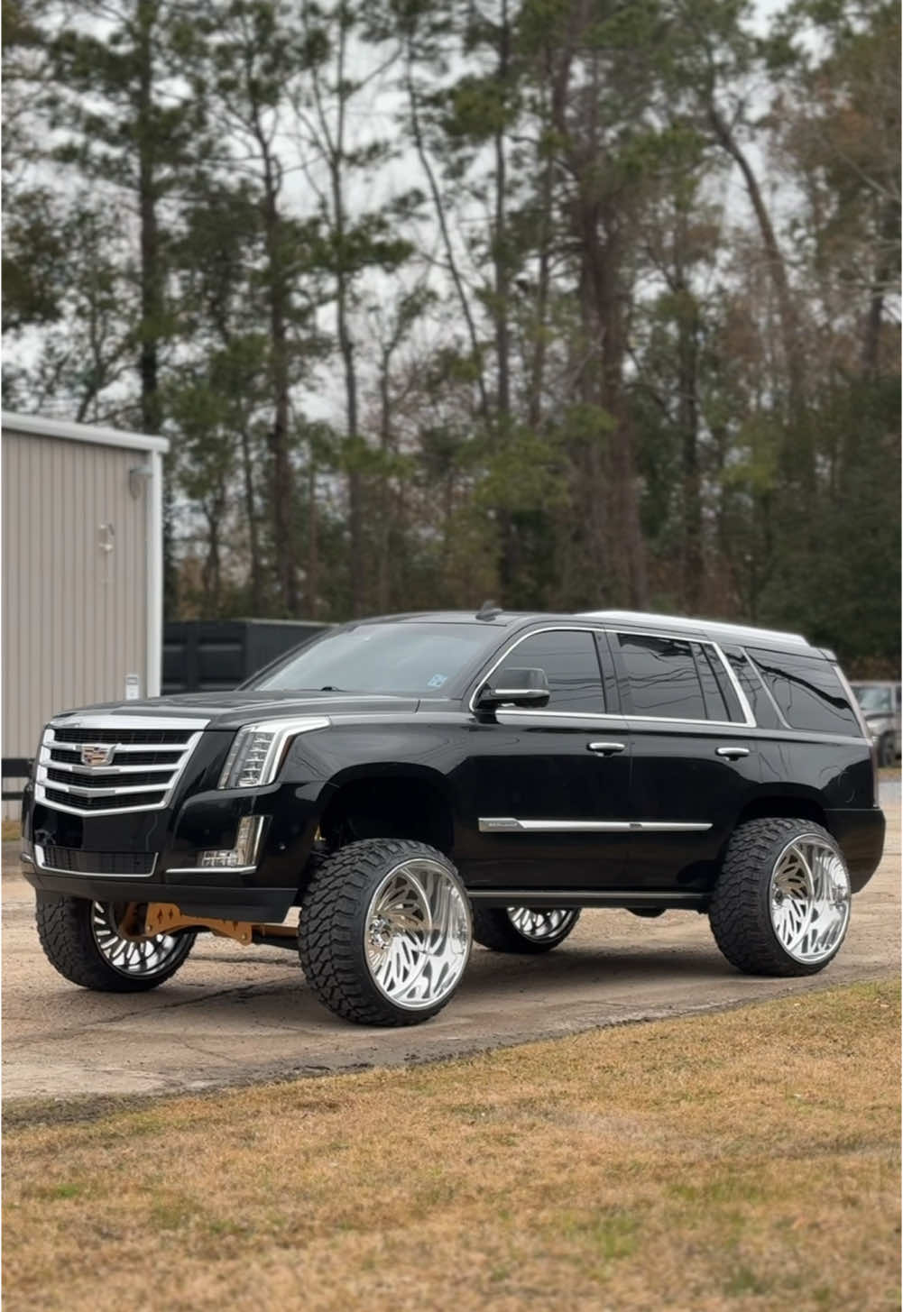 A post by @jesselawless on TikTok caption: My ole lady making my junk look bad😮‍💨🔥 #liftedtrucks #26x16 #squattedtrucks #trucksdaily #lifted #escalade #slide