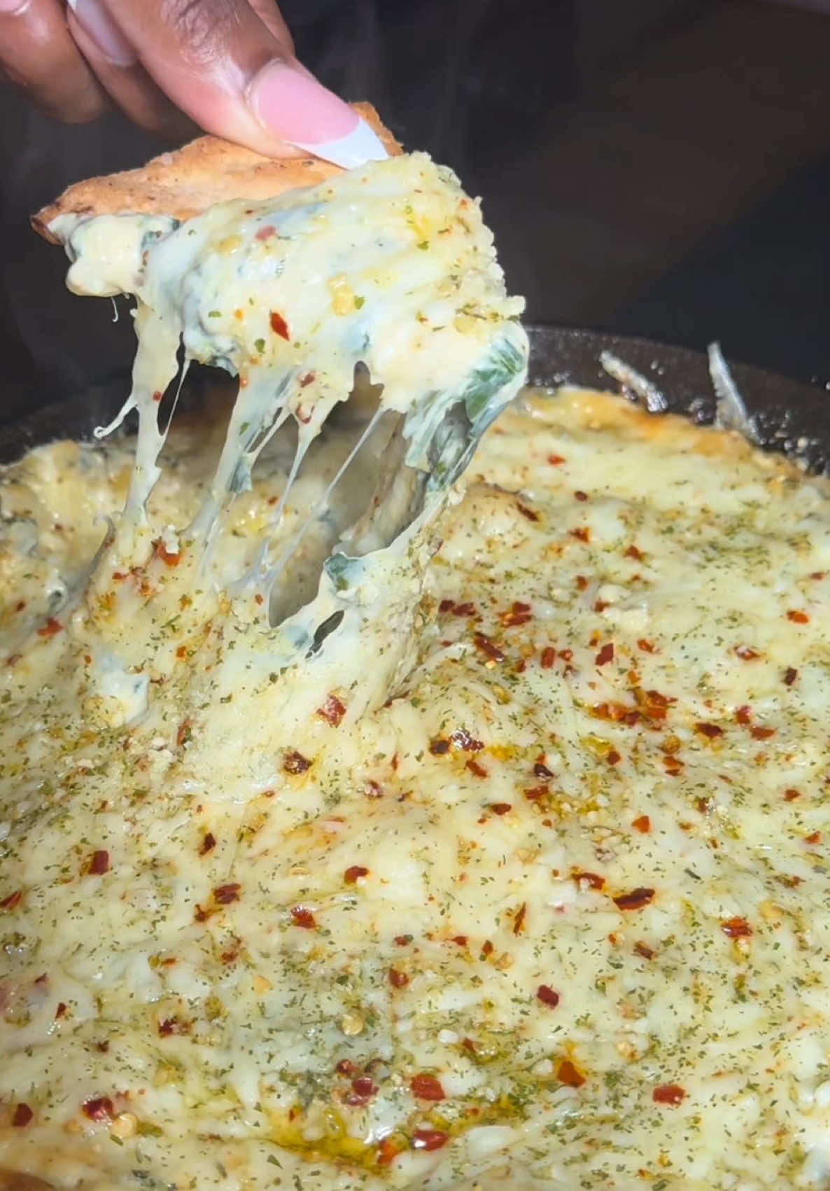 A post by @jordanramsy on TikTok caption: grammy winning spinach artichoke dip  for the big game ✨🏆🏈 @kendricklamar  16-18oz spinach  2 blocks cream cheese, softened  1 cup mozzarella 1/2 cup monterrey jack 1/2 cup parmesan  1/2 cup artichoke hearts, chopped  1/3 cup onion, diced  2 tbsp minced garlic  salt pepper garlic powder  onion powder  smoked paprika chili flakes aglio olio  Bake at 375 degrees  for 20-25 minutes #jordanramsy #spinach #superbowl #appetizers 