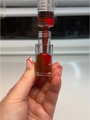 A post by @kikizcosmeticz on TikTok caption: Replying to @soph_dontfwu Chocolate covered strawberry gloss?! 😱🍓💐 I’m obsessed, what do you think?! #lipglossmaking #makinglipgloss #lipglossbusiness #kikizcosmeticz #ValentinesDay #valentineslipgloss 