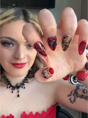 A post by @raynorshine3 on TikTok caption: Beautiful press ons made and done by @Nyssa ❤️🖤 #foryou #nails #bettyboop #transition 