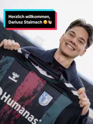 A post by @1_fcm on TikTok caption: 👋🏻 Willkommen in Magdeburg, Dariusz! 💙🤍 #HerzlichWillkommen #stalmach #magdeburg #fcm #football #fussball #2Bundesliga #newplayer #fyp #foryou #fy #EINMALIMMER 💙🤍 #fürMagdeburg 