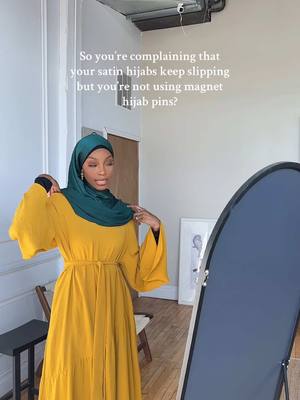 A post by @ansari.sumayah on TikTok caption: Snag-free, easy to use, strong and durable! Our Magnet hijab pins are perfect for all hijab materials. Wearing our (dark green) satin hijab here. #fyp #modest #foryou 