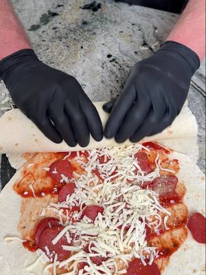 A post by @fooddudescook on TikTok caption: Jumbo pizza rolls recipe #cheesepizza #italianfood #simplemeal