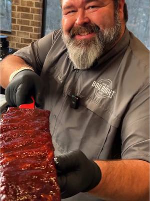 A post by @howtobbqright on TikTok caption: Hot Honey Ribs Hot Honey Ribs Recipe - 3 slabs St. Louis Spare Ribs - 1/4 cup Killer Hogs Hot Sauce - 1/4 cup Killer Hogs Hot Rub For the Rib Wrap: - 1 cup light brown sugar - 10oz apple juice - 1/4 cup Mike's Hot Honey - 1/4 cup Killer Hogs Vinegar Sauce - 3 sticks salted butter (split in half lengthwise) For the Rib Glaze: - 1 cup Killer Hogs The BBQ Sauce - 1/4 cup Mike's Hot Honey Directions: 1. Trim ribs and remove membrane. Apply light coat of hot sauce for a binder and season well with Killer Hogs Hot Rub. 2. Prepare pit for smoking at 275°F using hickory wood for smoke flavor. I used my Outlaw stick burner pit but any smoker/indirect grill will work just keep the temp steady at 275°F. 3. Place the ribs on the pit and smoke for 2 hours. Spritz with water if the outside starts to look dry after an hour in the smoke. 4. Make the rib wrap liquid - combine brown sugar, apple juice, hot honey, and vinegar sauce in a glass measuring cup.  Microwave for 3 1/2 minutes and allow to cool at room temp. 5. To wrap the ribs remove each slab from the pit; use a double layer of aluminum foil; place the ribs meat side down on the foil, add 1/2 cup of wrap liquid to each slab; place 1 stick of the butter over the top; and close the foil around the ribs.   6. Place the ribs back on the pit and cook for 1 1/2 hours or until tender.  Internal temp should be around 202-205°F. 7. Rest the ribs in a dry cooler for 1 hour before glazing. 8. To glaze: place each rack on a foil covered raised cooling rack meat side down; dust with a little Hot Rub and place back on the pit for 5 minutes; brush with The BBQ Sauce and cook for 7 additional minutes.  Flip the ribs over and dust the meat side with Hot Rub and return to the pit for 5 minutes.  Brush the meat side with The BBQ Sauce and drizzle with Hot Honey; blend the honey in with the bbq sauce and return to the pit for 7 additional minutes to set.   9.  Cut the slabs into individual bone pieces and serve. #bbqribs #bbqtiktok #howtobbqright 