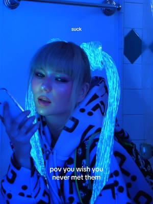 A post by @sorana on TikTok caption: ‘KISS BACK’ OUT AT MIDNIGHT. 🪼 #originalmusic #originalsong #songwriter #singing #newmusic #darkpop #nightcore #grimes #brat #charlixcx #anime #cosplay #wighair #hatsunemiku 