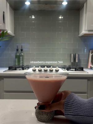 A post by @lexijxhnson on TikTok caption: Valentine’s Day Cocktails pt. 4: Pink espresso martini (strawberries & cream espresso ‘tini)  Now this is what I’m making for Galentine‘s because we’re espresso girls and this was too good  2.5 oz Vodka  2.5 oz Bailey’s (I did strawberries & cream) 3 oz Fresh espresso   Red food coloring 