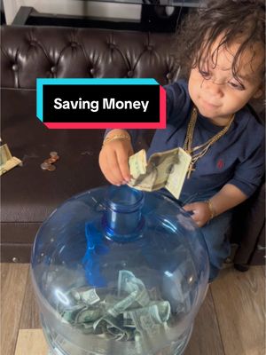 A post by @shaunathebarber on TikTok caption: Papi Jay has a bank account that I gifted him for his first birthday. I’m now teaching him the principle of in house. He’s always asking for money, so he can put it in his money saver. If you leave money out and you can’t find it, just know it’s in here 🤭. 