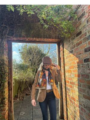 A post by @hxn_smith26 on TikTok caption: Adding the perfect finishing touch with the Heads or Tails navy classic silk scarf from @clarehaggas 🦋  (gifted) _ Scarf @Clare Haggas  Hat & Blazer @joules   Belt & Jeans @Holland Cooper Clothing  Boots @Fairfax & Favor  __ #countryside #OOTD #fashion #ootdfashion #country #britishcountryside #tweed #howtodresscountry  