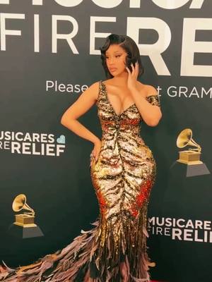 A post by @weddingouioui on TikTok caption: 🌸🍃  @iamcardib glitters in gold @roberto_cavalli at the 2025 #Grammys .  voguemagazine 📷. . . . .   #weddingring #bride #Love #Paris #dubai #weddingsouioui #eventplanner #celebrity #makeup #weddingcake #Engaged   #california Repost 🌿