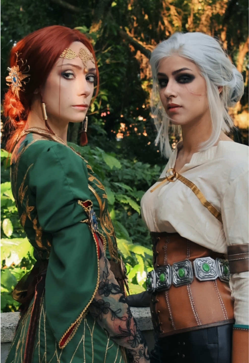 A post by @nickybrum_ on TikTok caption: WHERE ARE THE THE WITCHER 3 FANS?????? 🐺 Triss Merigold and Cirilla just waiting for your answer!  . So proud of these cosplays! Can you believe we did this by hands?  Who should we do next?  . Triss by @RagMig 💚