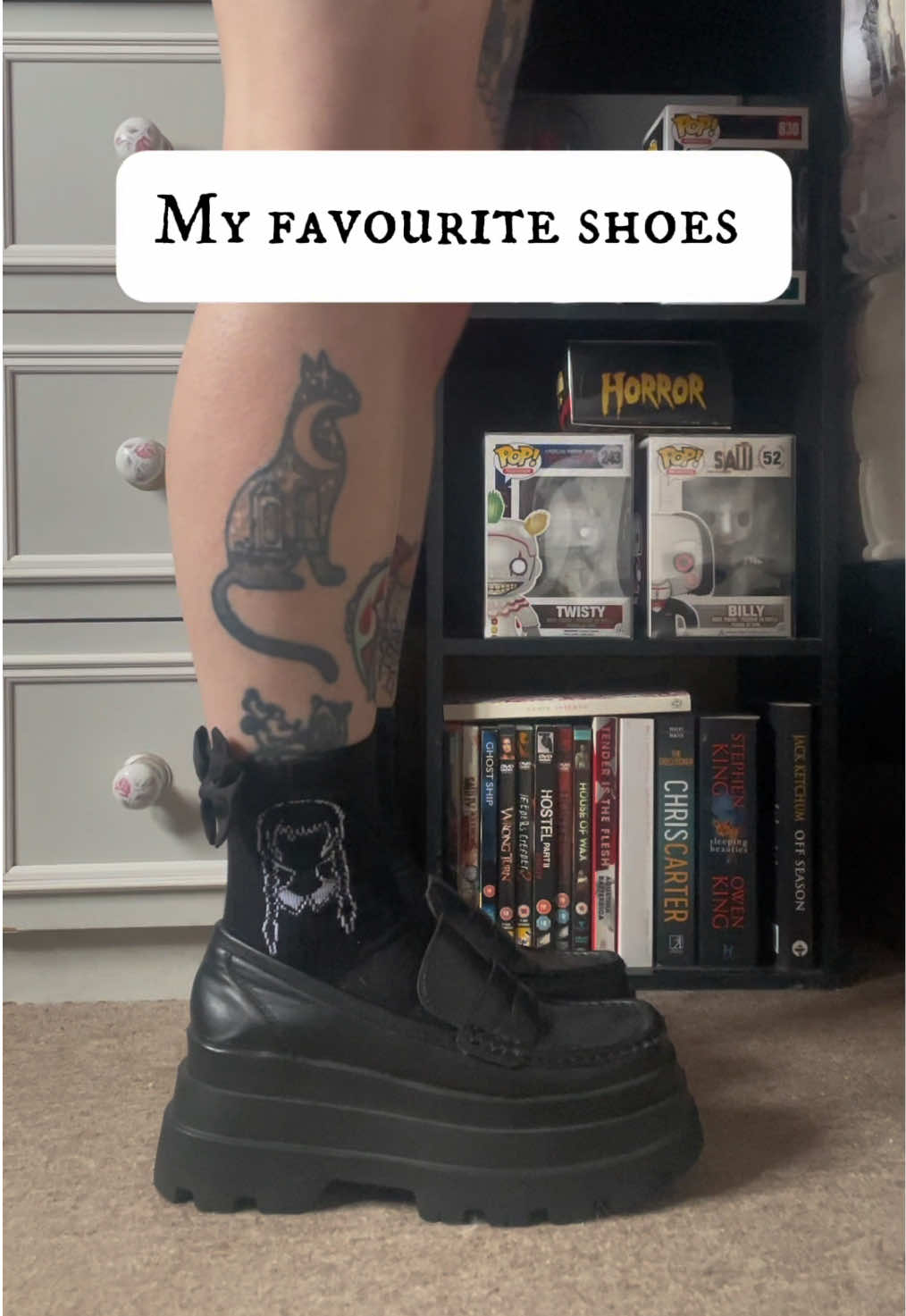 A post by @arianamageeginn on TikTok caption: A round of my fave shoes to wear! Yes they’re all platforms and yes they’re VERY different! (That’s what I tell myself) which is your faves! 🖤⛓️ #alttiktok #alternative #altgirl #altoutfit #gothic #gothicstyle #tattoos #shoecollection #drmartens 