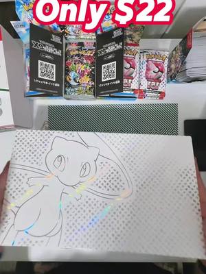 A post by @feee404 on TikTok caption: Get ready for spectacular reveal as we unbox the Scarlet & Violet 151 Ultra Premium Box! #pokermon 