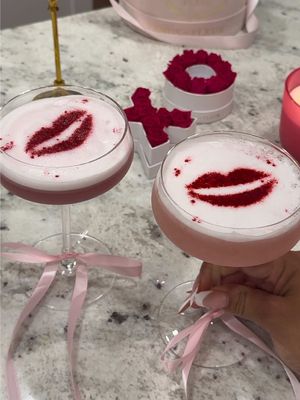 A post by @brooklynn_mullins on TikTok caption: Your Sign To Make A Cupids Kiss Cocktail! Perfect For Gal/Valentines Day! 💗 #cocktails #homebartender #galentinesday #galentines #valentinesdaycocktail #cocktailrecipe #drinkrecipe 