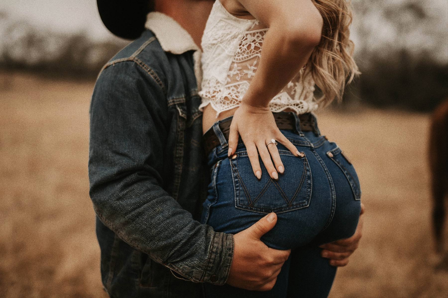 A post by @tbaphotography on TikTok caption: Imagine this: the golden sun dipping low over a wide-open field, the country tunes in the air, and the two of you stealing glances that could rival any silver-screen love story. That’s the magic of a Western-themed engagement session. It’s fun, intimate, and unapologetically you. From slow dances under the sky to playful moments in boots and denim, every detail is a snapshot of your unique story. We’re not just capturing photos; we’re preserving nostalgic memories that feel like home—moments you’ll cherish forever. It’s your love, your story, told in a way that’s timeless, authentic, and a little wild at heart. So saddle up and let’s turn your love into the cinematic masterpiece it deserves to be. 🎥🤍 #westerntheme #texasphotographer #engagement #photography #westernstyle #denim #westernlifestyle #wrangler #boots #cowboy #horses #memoriesforlife #sayingido #tiktok #fy #fypシ #foryoupage 