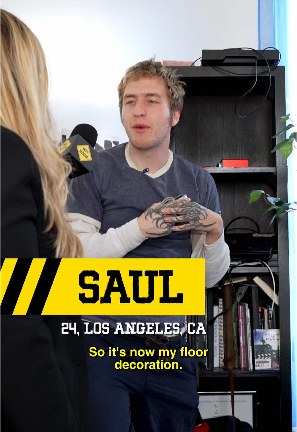 A post by @boyroomshow on TikTok caption: Saul, 24, Los Angeles, CA Welcome to Boy Room, the show where we investigate men's bedrooms and fix them. On today's episode, Rachel visits Saul, a guy who has Christmas themed bedding -- despite not celebrating Christmas at all. hosted by @rachelcoster_   a show by @Gymnasium   in partnership with @prime  #messy #hoarders #LA #renovation #comedy #boyroom #gymnasium 
