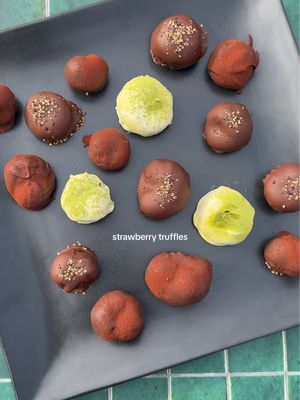 A post by @zoebarriesode on TikTok caption: strawberry truffles! 🍓  note: dark chocolate ganaches are 1:1 chocolate to heavy cream ratio (ex: 50g : 50g); white chocolate is a little over 2:1 white chocolate to heavy cream ratio (ex: 110g : 50g) #ValentinesDay #dessert 