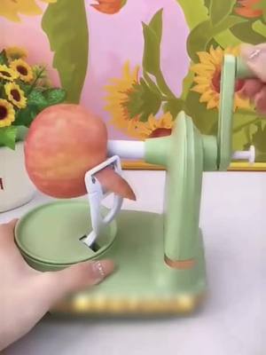 A post by @goodiesarehere on TikTok caption: Hand crank peeling apple peeler household fruit peeler multifunctional peeling machine automatic beating knife scraping #goodssharing #lifegoods 