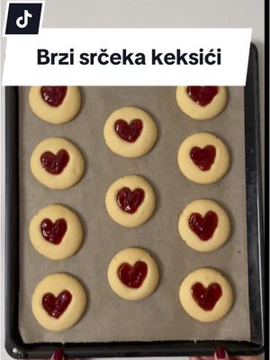 A post by @marijamazalin on TikTok caption: Brzi srčeka keksići ❤️ SASTOJCI • 70g šećer • 140g maslac • 180g glatko brašno • džem (od jagoda) RECEPT 1. Izmiksajte šećer i maslac narezan na skroz tanke listiće 2. Umiksajte i brašno - upalite pećnicu na 160’C 3. Formirajte 11 kuglica od 35g ili 12 od 32g i položite na pleh obložen papirom za pečenje 4. Svaku kuglicu spljoštite dlanom na pola debljine pa vrhovima prstiju udubite srčeka 5. Pecite 20-25min na 160’C (ovisi o jačini pećnice) 6. Kad su izvađena iz pećnice i još mekana, odmah dodatno udubite srčeka (kako bi udubina bila dublja), a onda čekajte da se keksići skroz ohlade i stisnu 7. Punite srčeka džemom od jagode Sretno Valentinovo svima koji slave! ❤️ #valentinovo #keksici #srceka #recept #jednostavnirecepti #brzirecepti #brzidesert #desert #valentines #ValentinesDay #cookies #heartcookies #valentinesrecipes #EasyRecipes #quickdessert 