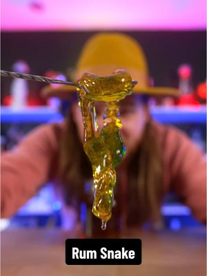 A post by @dokaryan on TikTok caption: I left Snake in Rum for a week #dokaryan #inajar #snake #rum #fyp #bartender 