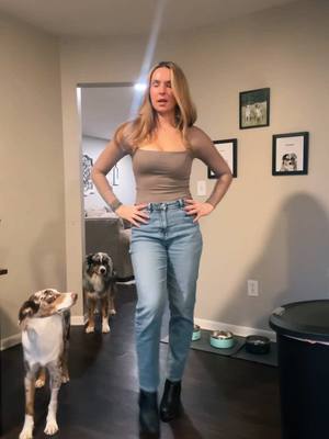 A post by @lizbembas on TikTok caption: fit check w the puppies #fitcheck #OOTD 