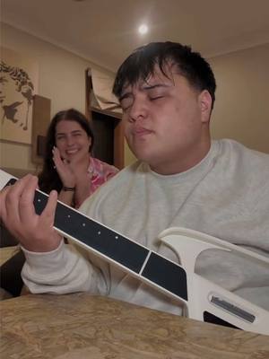 A post by @kobeewhite on TikTok caption: Her smile gets me every time 🥹🤍  Playing the worlds first Stringless guitar by @LiberLive Store for Valentines Day ❤️ Link in my bio to get one now! #liberlive #liberlivec1 #stringlessguitar #smartguitar #singing #singer #reaction #reactionvideos #reactionvideo #coversong #cover #imyours 