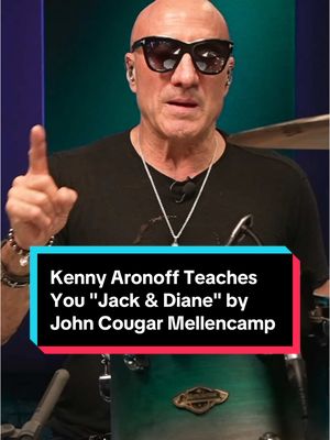 A post by @drumeoofficial on TikTok caption: Kenny Aronoff Teaches You "Jack & Diane" by John Cougar Mellencamp. 👊🏼 #jackanddiane #johnmellencamp #classicrock #80smusic #americanheartland #rockanthems #smalltownlife #musicnostalgia #rocklegends #throwbacktunes #heartlandrock #americansongwriter #pinkhouses #smalltown #musichistory #kennyaronoff #drumminglegend #sessiondrummer #drumeo