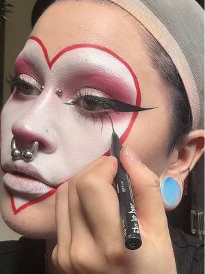 A post by @motherof.hades on TikTok caption: happy VALLOWEEN my sweet batty people 🦇🖤🥀@𝔇𝔯𝔬𝔭𝔇𝔢𝔞𝔡𝔊𝔬𝔯𝔤𝔢𝔬𝔲 @NYX Professional Makeup  #goth #gothmakeup #gothmodel #gothsofinstagram  #gothsubculture #motherofhades #valentine #valentinesday #valentinesmakeup #heartmakeup #fyp #foryou #trending 