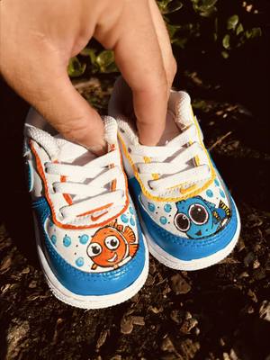 A post by @ctmwrld on TikTok caption: Custom finding Nemo toodler af1 🐡🐠 . . . #fypシ #customshoes #explorepage✨ #fashiontiktok #customairforce1 #af1customs #viraltiktok #handpainted #findingnemo #disneyoutfitideas #toodlershoes 