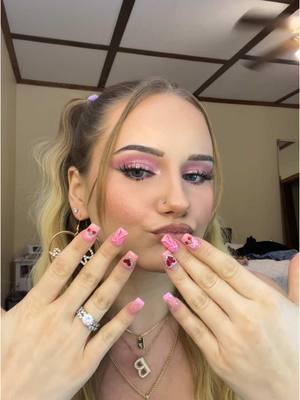 A post by @breedutkiewicz on TikTok caption: Happy Valentine’s Day to all my baddies🩷🎀  #ValentinesDay #valentinesmakeup #makeup #pinkmakeup #valentinesnails 