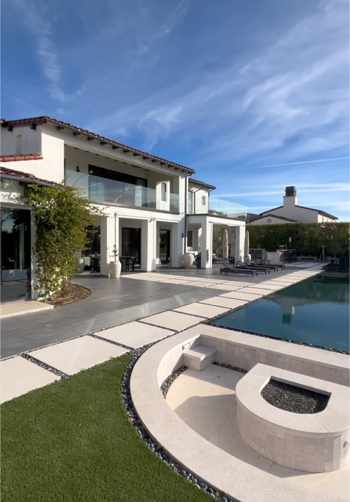 A post by @luxlistings on TikTok caption: Met the one woman who designed the whole inside of this home.. was so cool to see 🤩 #calabasas #luxurylistings #luxuryhomes 