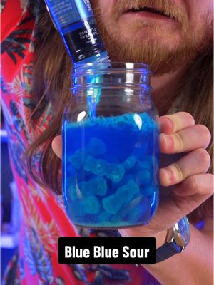 A post by @dokaryan on TikTok caption: I left Blue Raspberry Sour Patch Kids in Blue Curaçao for a week #blue #blueraspberry #sourpatchkids #dokaryan #fyp #yqr #bartender 